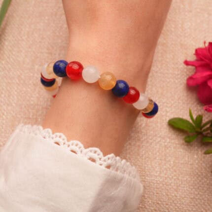 Person wearing Handmade Lapis Lazuli, Red Agate, Citrine & White Chalcedony S925 Bracelet, showcasing its colorful design