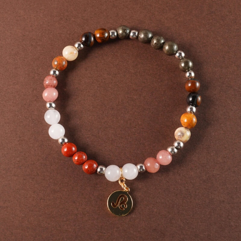 Leo Red Jasper, Crazy Lace Agate, Strawberry Quartz and Tiger Eye adjustable bracelet on white background