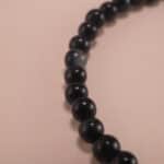 Close-up of Blue Tiger Eye Beads and Sterling Silver Charm – 4mm Gemstone Bracelet