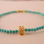 Close-up of natural turquoise beads and knot detail