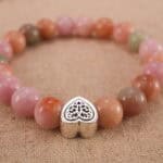 Close-up of pink salt source agate beads with premium S925 sterling silver accents