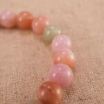 Close-up of pink salt source agate beads with premium S925 sterling silver accents