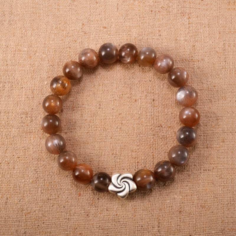 8mm sunstone and moonstone bracelet with S925 silver charm on white background