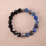 Blue aventurine and obsidian gemstone bracelet on a clean background, showcasing the 8mm beads.