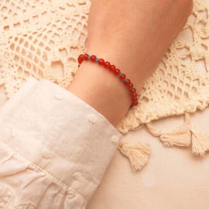 Woman wearing 4mm red agate and apatite bracelet – elegant natural stone jewelry for energy