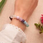 Person wearing Handmade Seven Chakra Bracelet, showcasing the chakra beads in a minimalist design