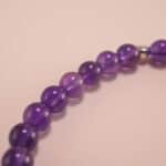 Close-up of deep purple amethyst beads and sterling silver details