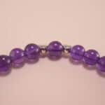 Close-up of deep purple amethyst beads and sterling silver details