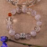 Bracelet resting in a peaceful natural setting with soft light