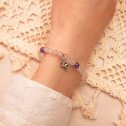 A relaxed wrist wearing the amethyst bracelet, showing how it fits gently and comfortably