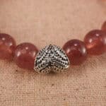 Close-up of Strawberry Quartz Beads and Heart Charm – S925 Gemstone Bracelet