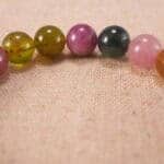 Close-up of Multicolor Tourmaline Beads and Sterling Silver Cross Charm