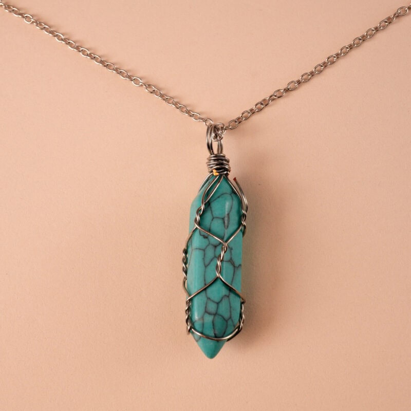 Close-up of the turquoise crystal point with setting detail