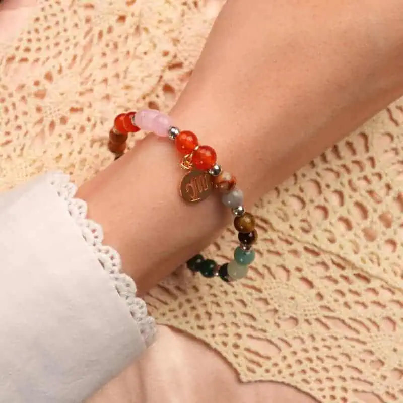 Virgo zodiac bracelet on wrist with rose quartz and tiger eye