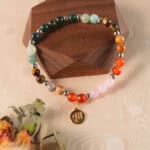 Virgo zodiac jewelry styled on wood for earthy aesthetic