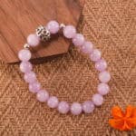 Placed in a serene, nature-inspired setting with soft lighting