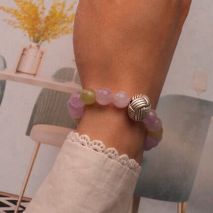 Kunzite & Prehnite bracelet styled on wrist with calming soft light