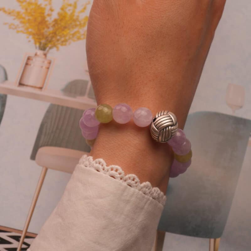 Kunzite & Prehnite bracelet styled on wrist with calming soft light