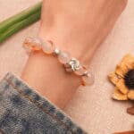 Model wearing a 10mm beaded crystal bracelet for daily healing