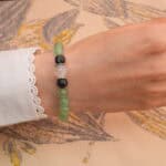 Model wearing the mixed gemstone 8mm healing bracelet