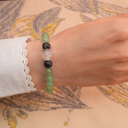 Model wearing the mixed gemstone 8mm healing bracelet