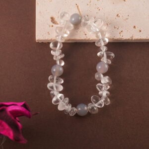 Crystal bracelet styled on neutral-toned fabric