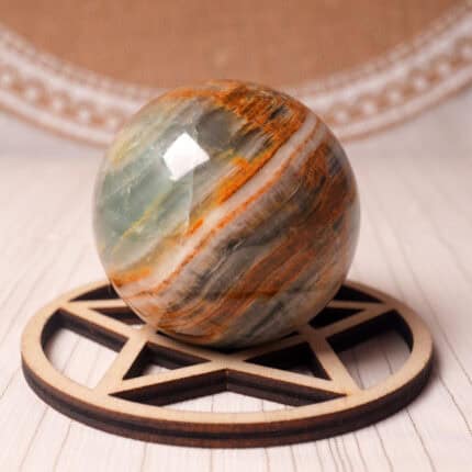 Polished Blue Onyx crystal sphere on a stand with subtle marbling