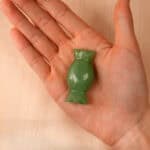 natural-green-onyx-candy-figurine-handheld.jpg" alt="Hand holding a polished Natural Green Onyx Candy Figurine, highlighting its glossy texture and vibrant green hues