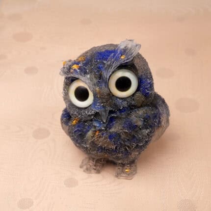 Close-up of owl figurine showing deep blue Lapis texture with gold flecks