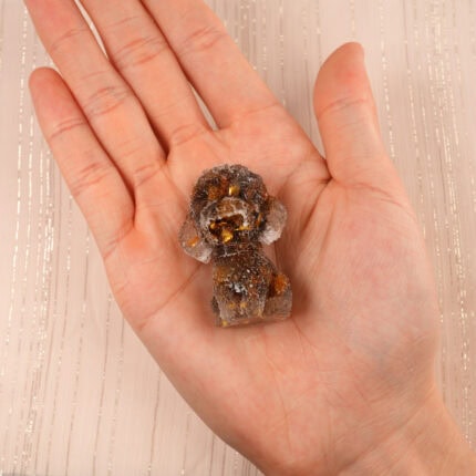 natural-resin-tiger-eye-dog-figurine-handheld.jpg" alt="Hand holding the Natural Resin Tiger Eye Dog Figurine, showing polished finish and warm golden-brown hues