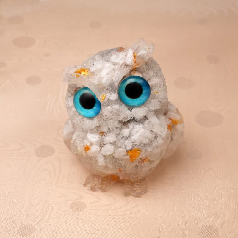 Close-up of owl figurine showing White Turquoise pattern and resin detail
