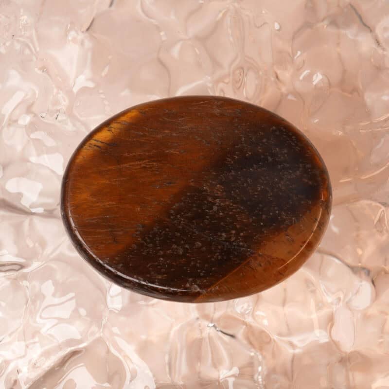 Natural Tiger Eye worry stone with golden-brown hues and smooth texture