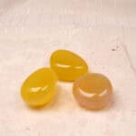 Yellow Agate Tumbled Stone Set showcasing polished yellow stones, perfect for enhancing energy and decor.