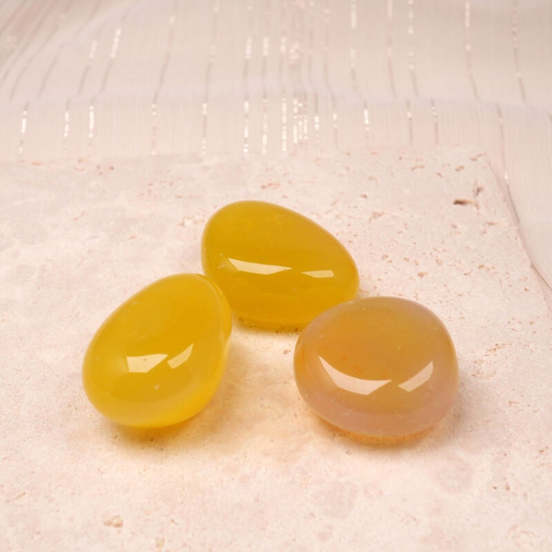 Yellow Agate Tumbled Stone Set showcasing polished yellow stones, perfect for enhancing energy and decor.
