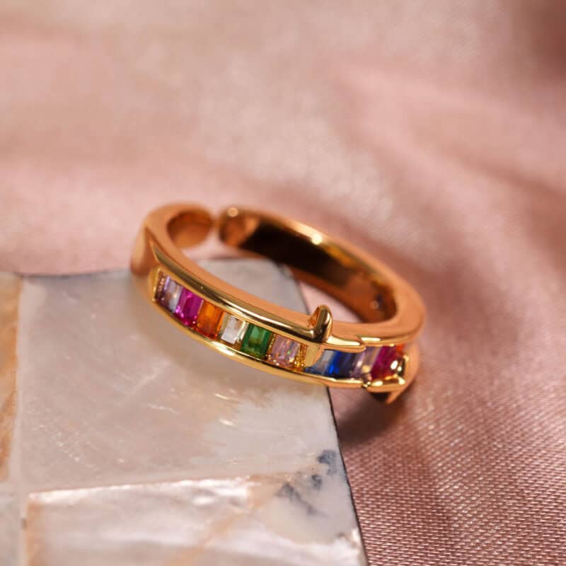 Rainbow Ring featuring vibrant zircon gemstones in multiple colors, displayed on a white background highlighting its brilliance