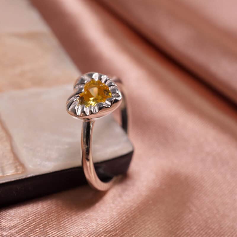 Yellow Gemstone Ring featuring a vibrant yellow zircon set in S925 sterling silver, standing upright to highlight its elegant design and vibrant stone