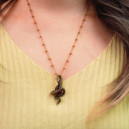 Model wearing the pendant for a dramatic, mystical effect at the collarbone