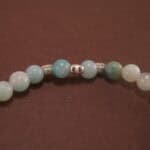 Close-up of amazonite bracelet with silver beads.