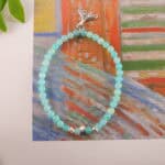 Amazonite bracelet in daylight showing soft green-blue hue.