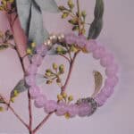 Amethyst bracelet displayed in natural light with soft neutral background.