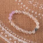 Bracelet in natural light showing soft purple and clear tones.