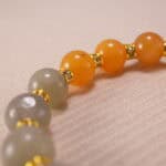 Close-up of gray moonstone and yellow chalcedony bracelet.