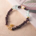 Overview of the bracelet’s full design, highlighting the gemstone arrangement and symbolic Aquarius charm.