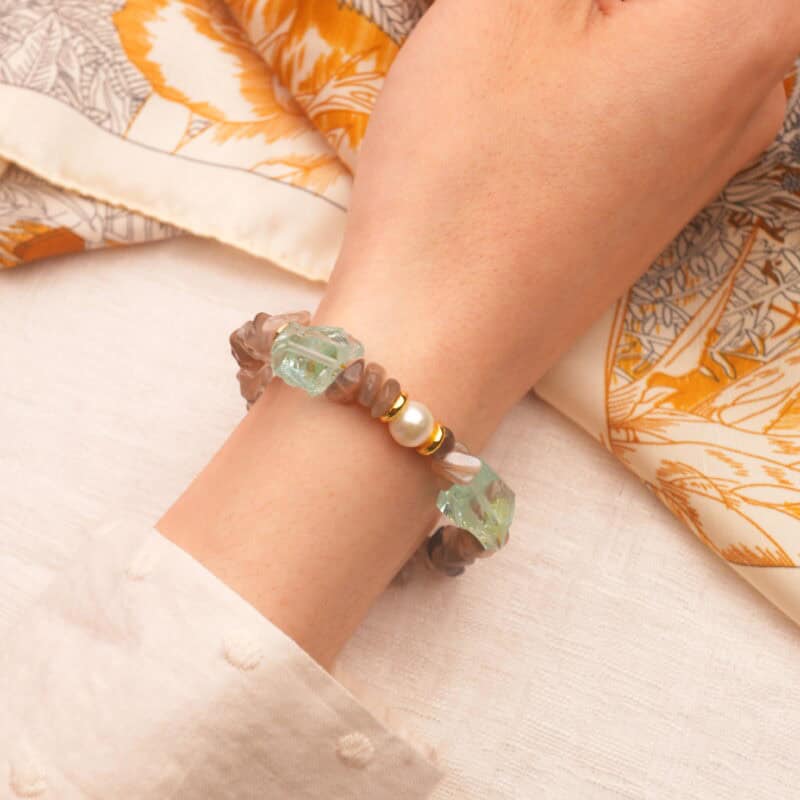 The Aries-themed bracelet styled on the wrist, showcasing its modern charm and natural gemstones.