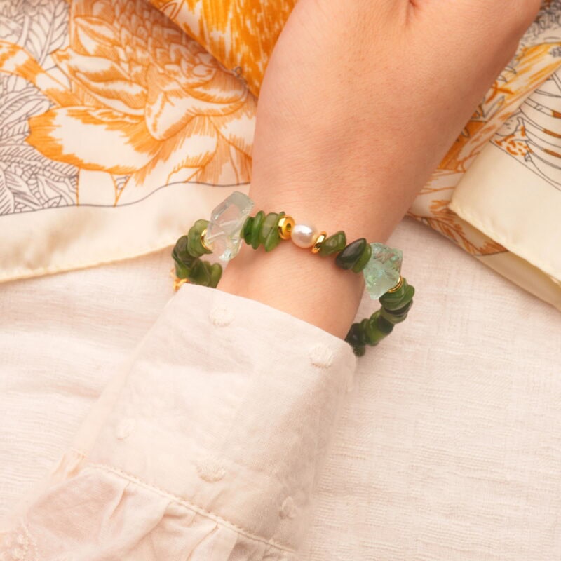 Capricorn zodiac bracelet worn on the wrist, showcasing a minimalist style with grounding crystal energy.