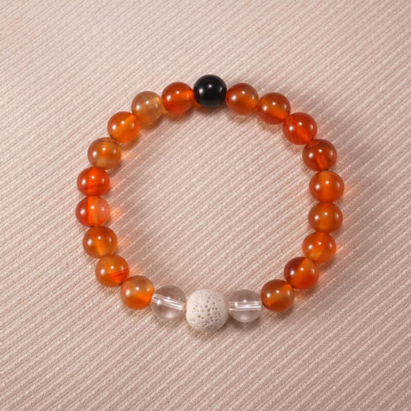 Handmade bracelet with carnelian, clear quartz, and lava stone beads – bold and energizing crystal jewelry.