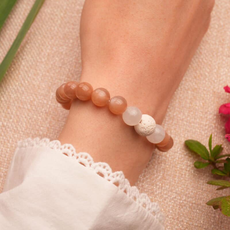 Wrist shot of the gemstone and lava stone bracelet – stylish and full of earthy elegance.