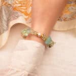 Pisces bracelet worn on the wrist, showcasing the soft glow of aquamarine and the gentle elegance of pearl and prehnite.