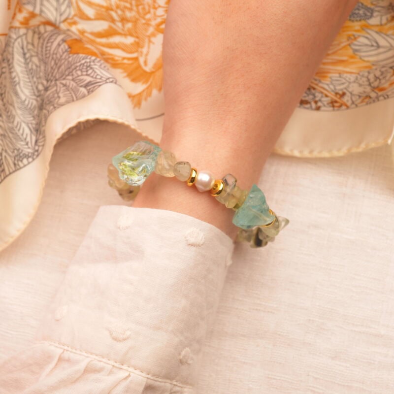 Pisces bracelet worn on the wrist, showcasing the soft glow of aquamarine and the gentle elegance of pearl and prehnite.