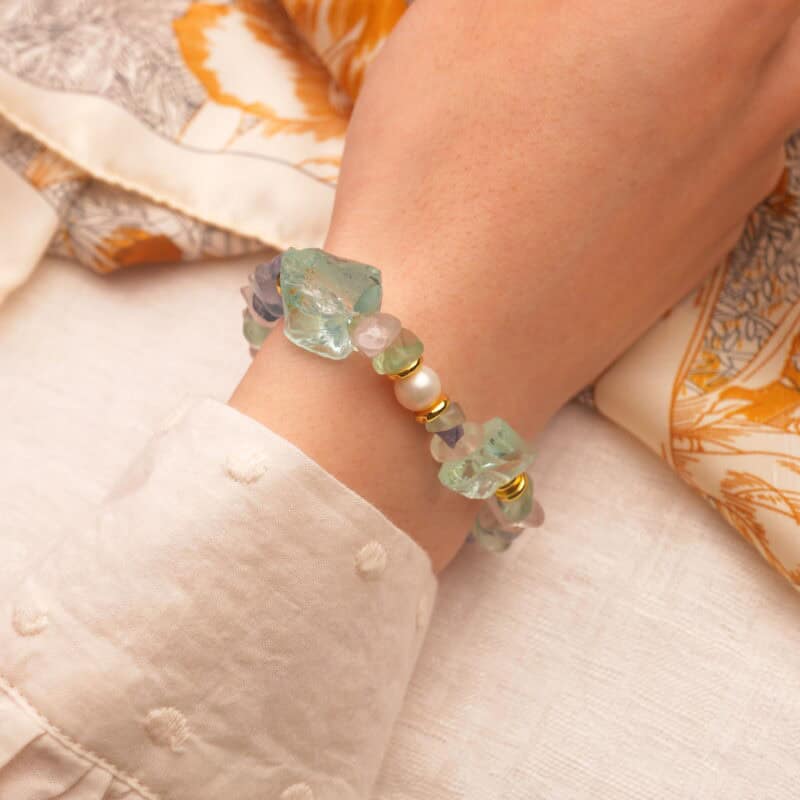 The Sagittarius bracelet worn on wrist, showing its elegant color blend and minimalist zodiac design.